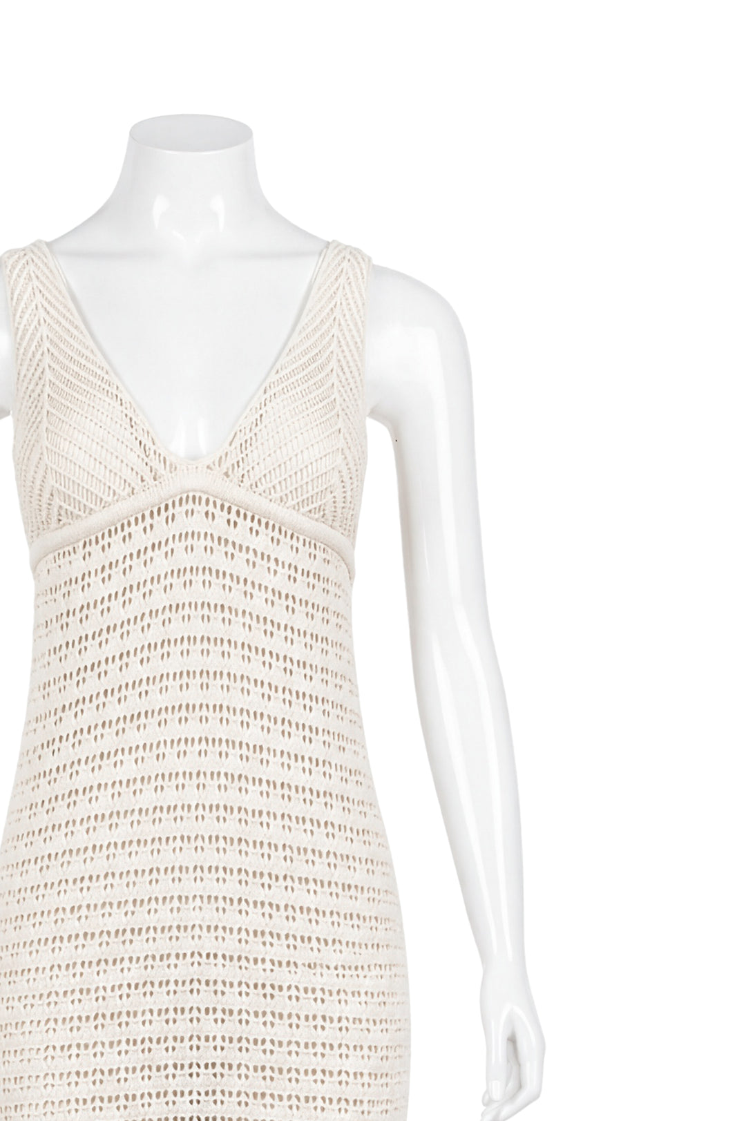 Close-up of beige crochet dress bodice and neckline detail