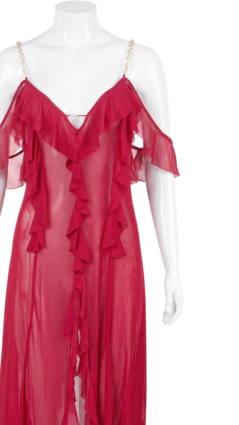Close-up product shot of red sheer gown ruffle and chain strap detail