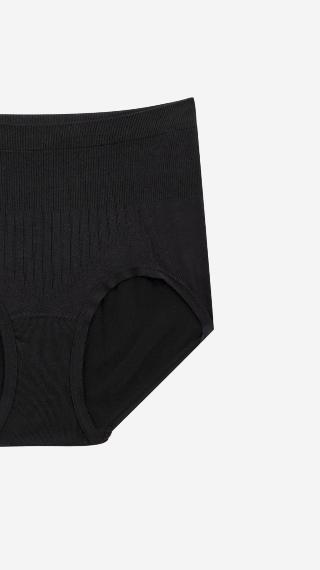 Close-up of black high-waist shaper brief ribbed panel on white background
