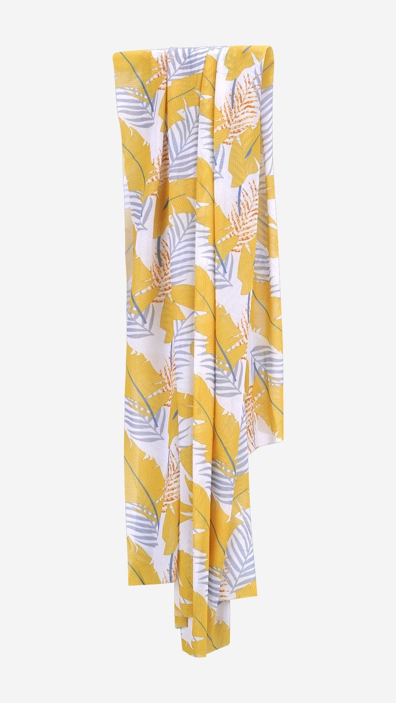 Flat lay of tropical print sarong fabric draped and hanging