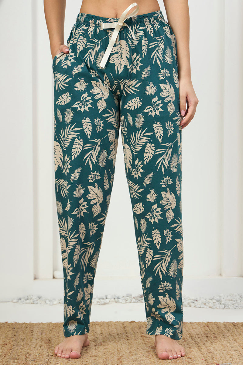 Close up of the drawstring waist and pocket detail on the teal printed pants