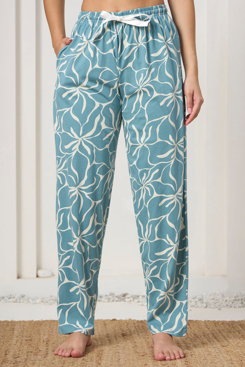 Close up of the drawstring waist and pocket detail on the dusty blue printed pants