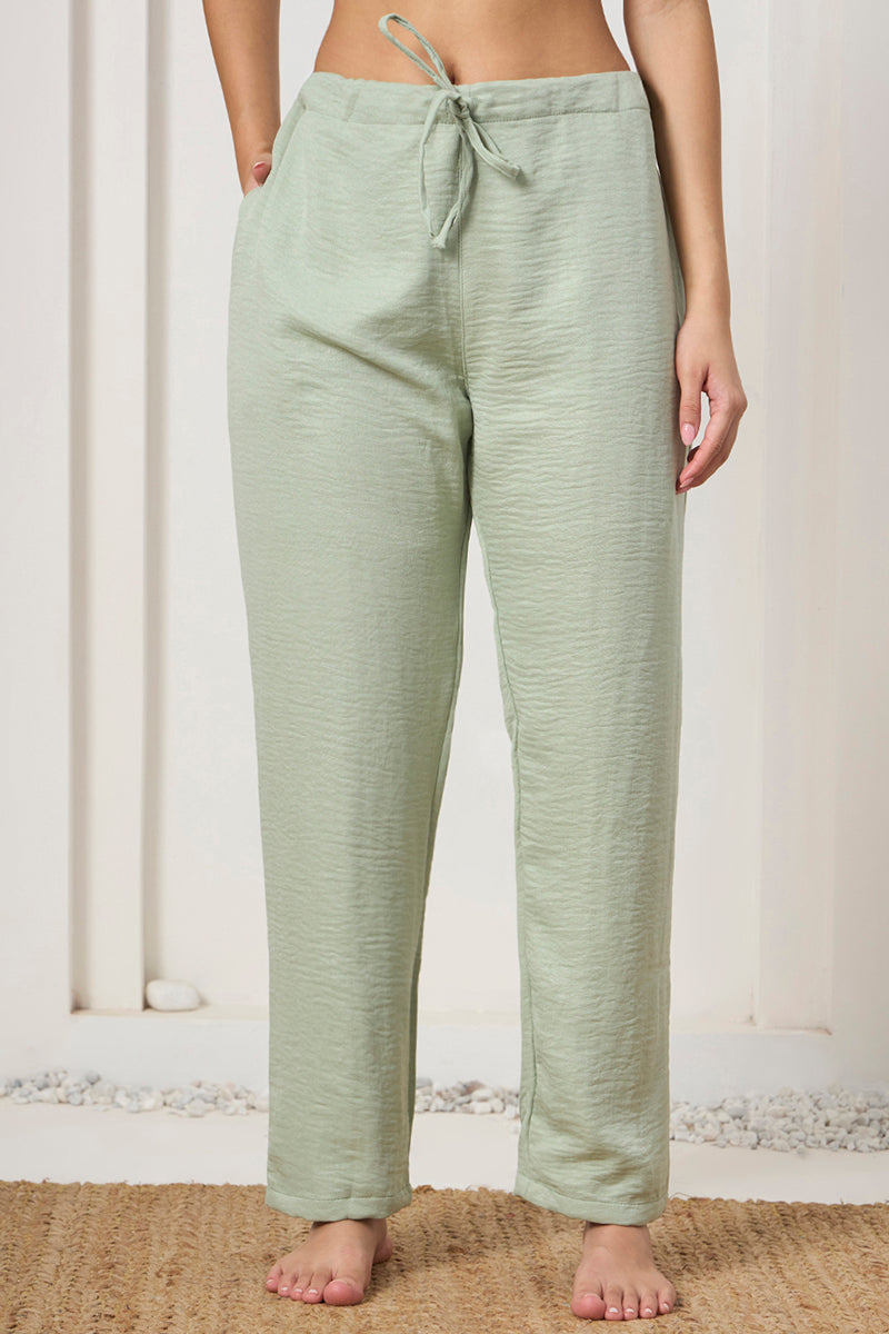 Close up of the drawstring waist on the sage green pants