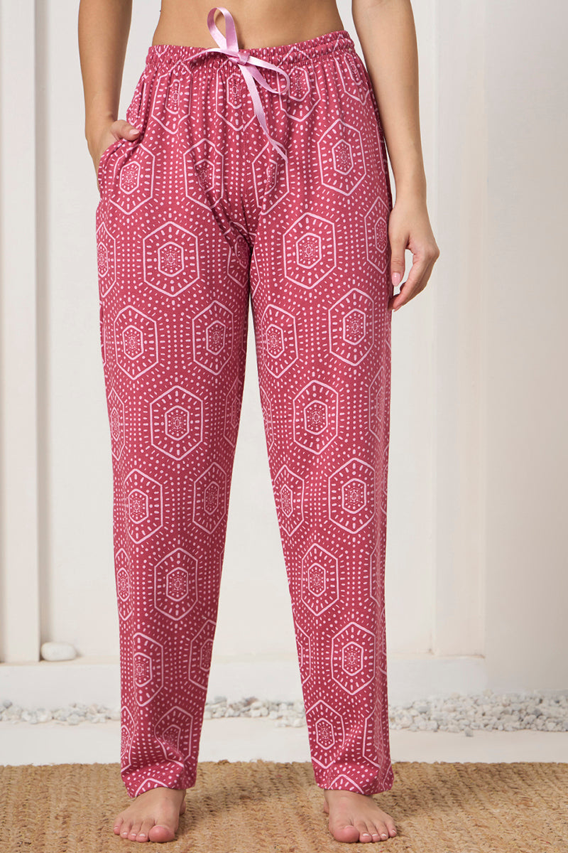 Close up of the drawstring waist and pocket detail on the pink bandhani print pants