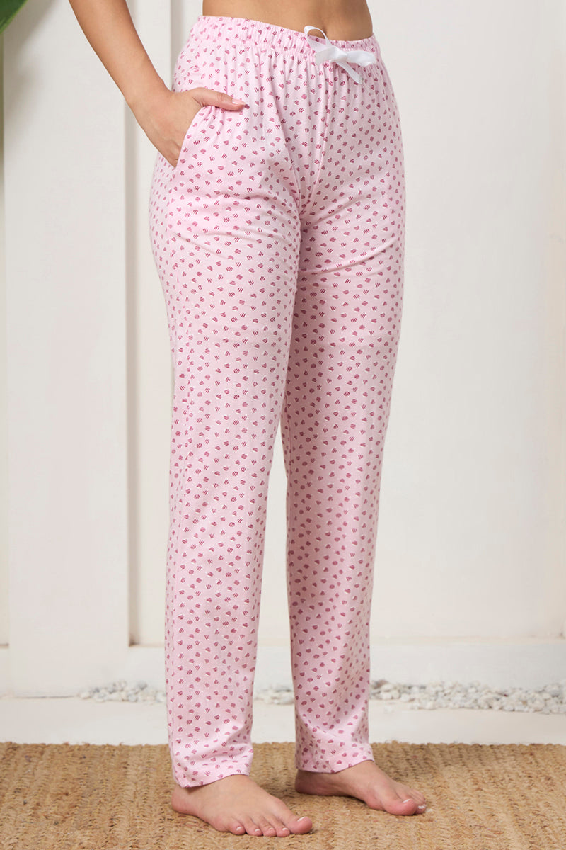 Close up of the drawstring waist and pocket detail on the pink printed pants