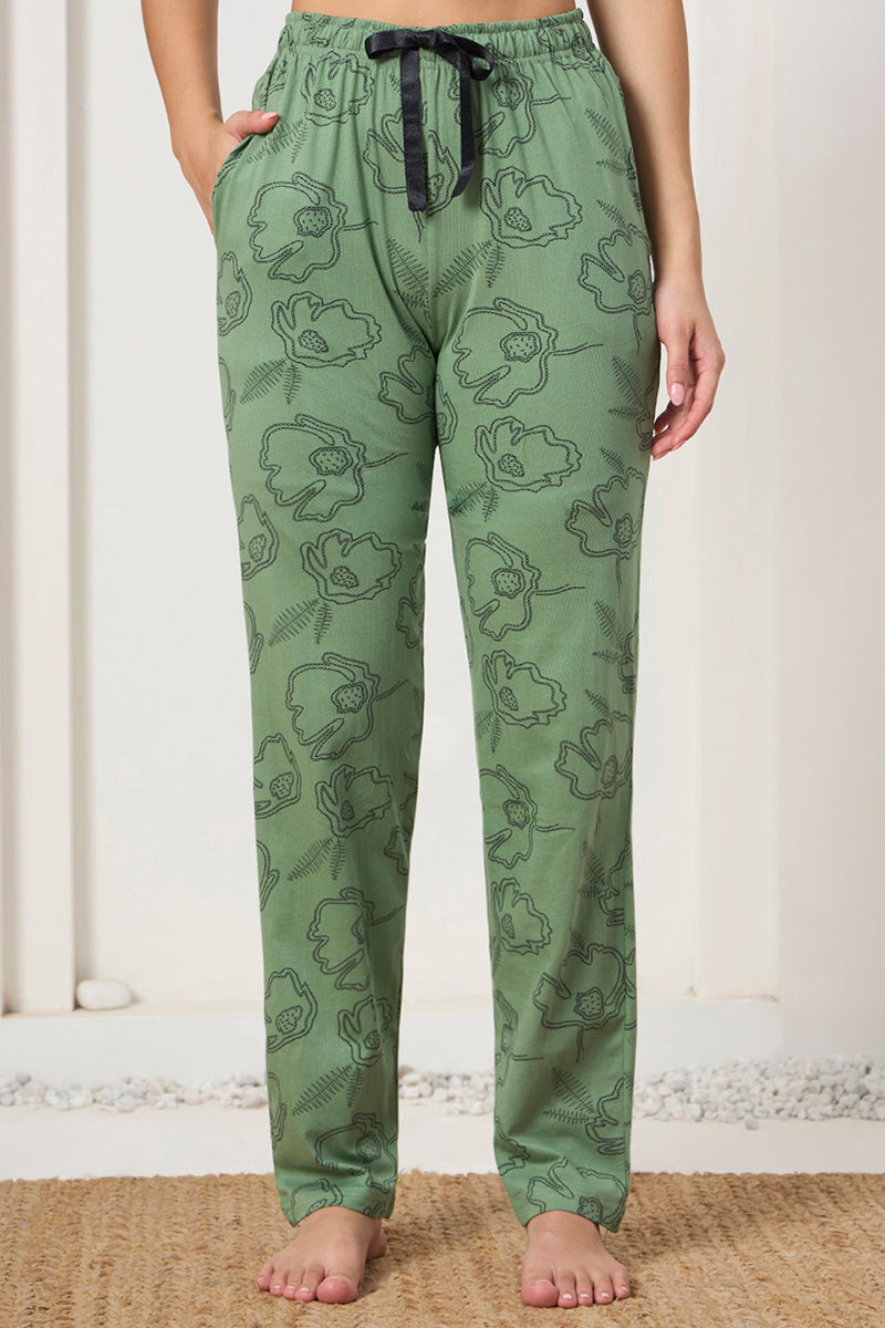 Close up of the drawstring waist and pocket detail on the sage green pants