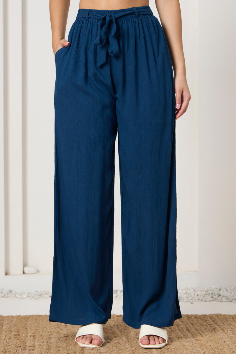 Close up of the tie waist on the teal wide leg pants