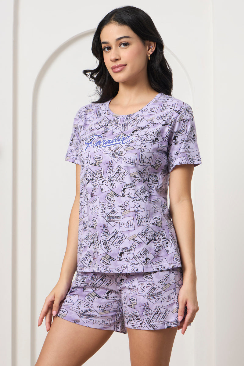 Woman posing in a lilac printed t-shirt and shorts set, front view