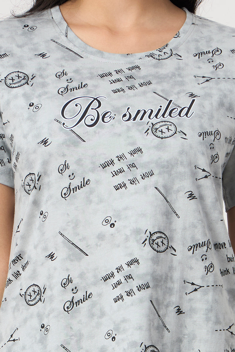 Close up of the be smiled graphic print on the grey t-shirt