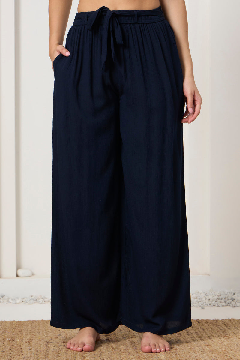 Close up of the drawstring waistband on the navy wide leg pants