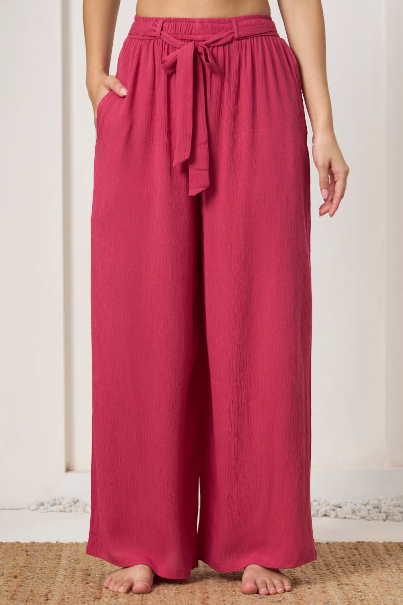 Close up of the tie waist and pocket detail on the pink wide leg pants