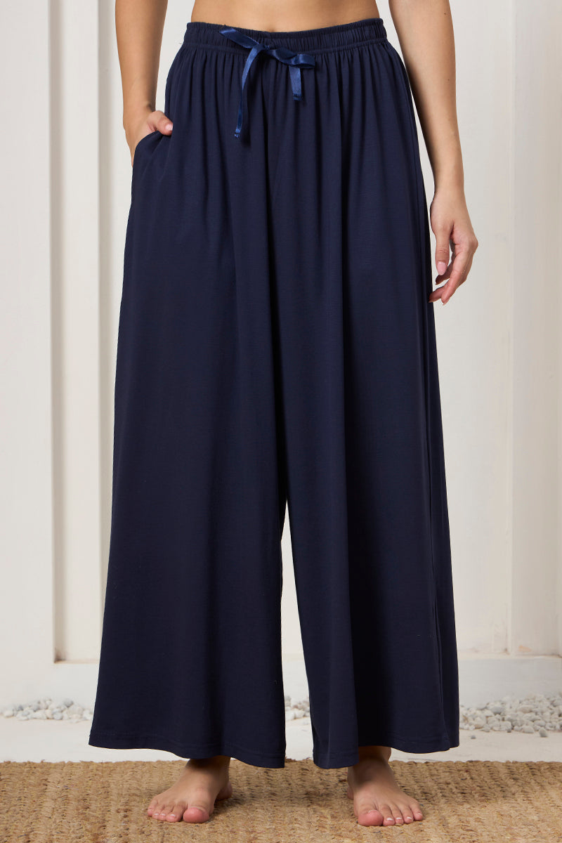 Close up of the drawstring waist on the navy wide leg pants