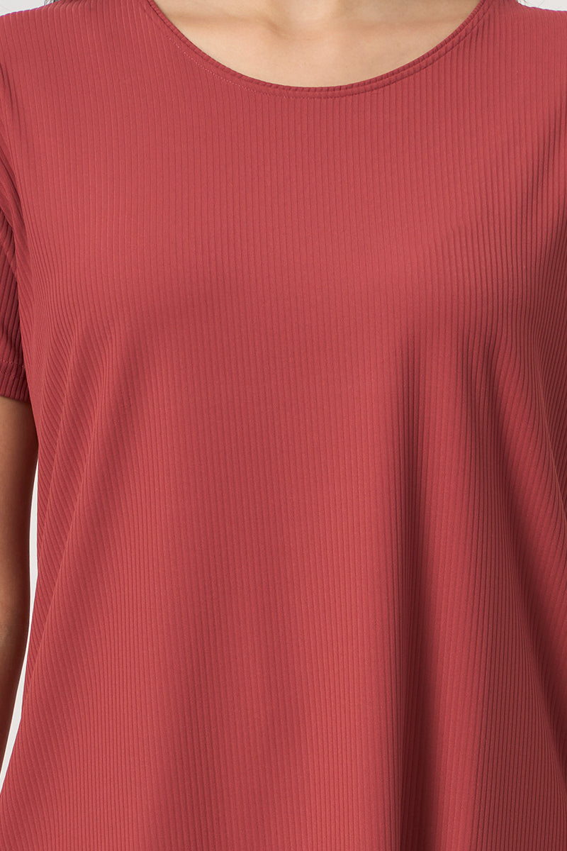 Close up of ribbed fabric and round neckline on pyjama top