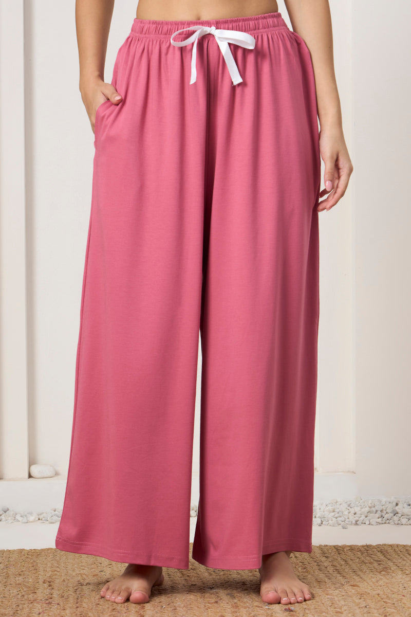 Close up of the drawstring waist on the pink wide leg pants