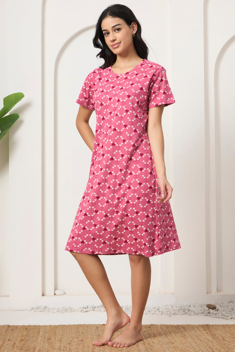 Woman posing in a pink heart print short sleeve nightdress