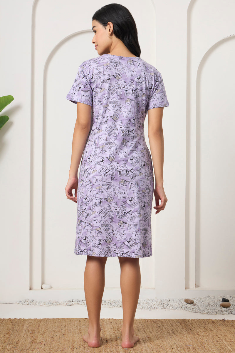 Back view of a woman wearing a lavender comic strip print nightdress