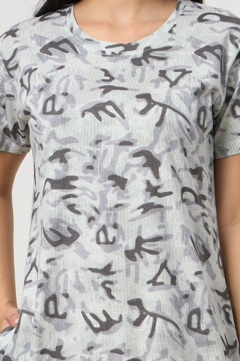 Close up of the abstract print texture on the grey nightdress