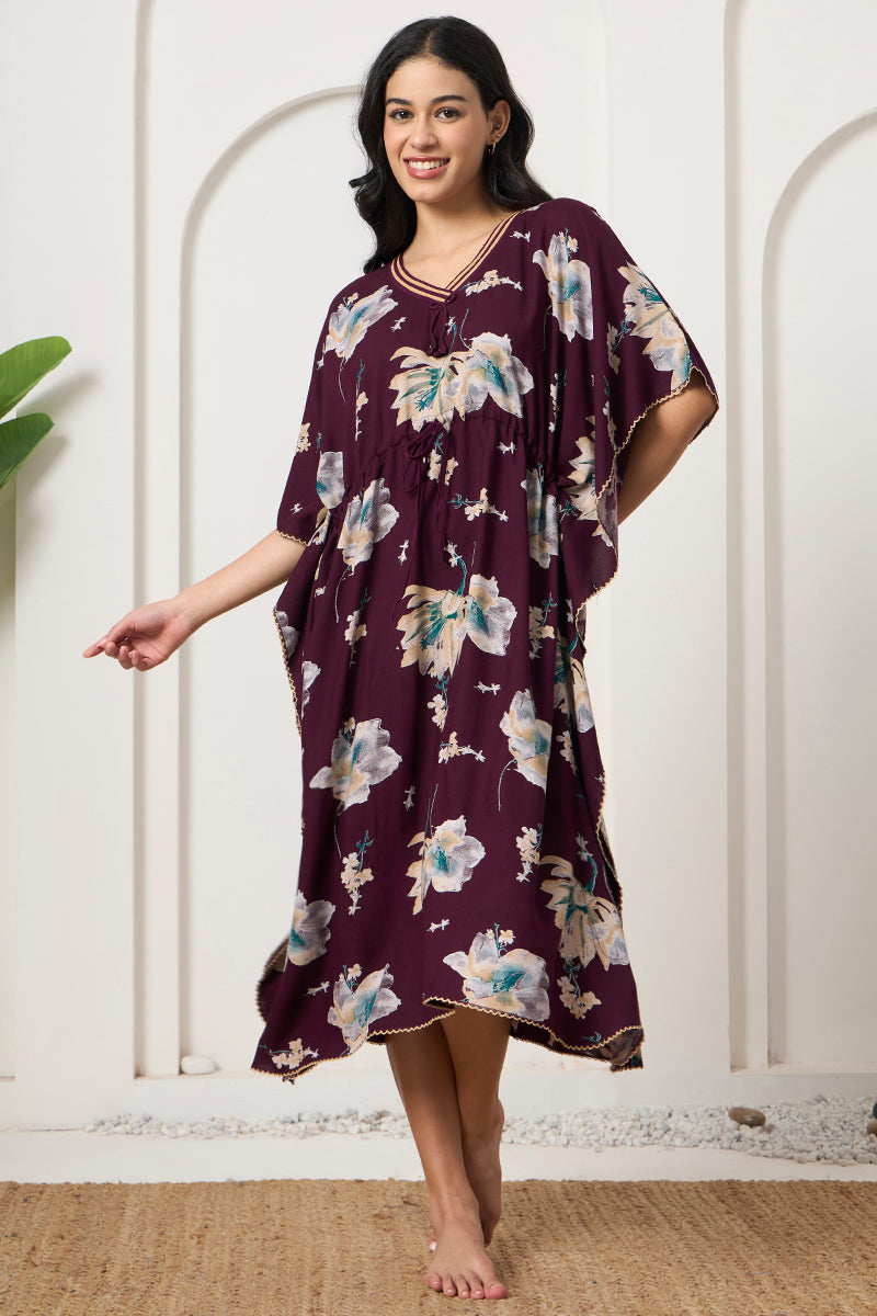 Woman smiling and walking in a wine floral kaftan