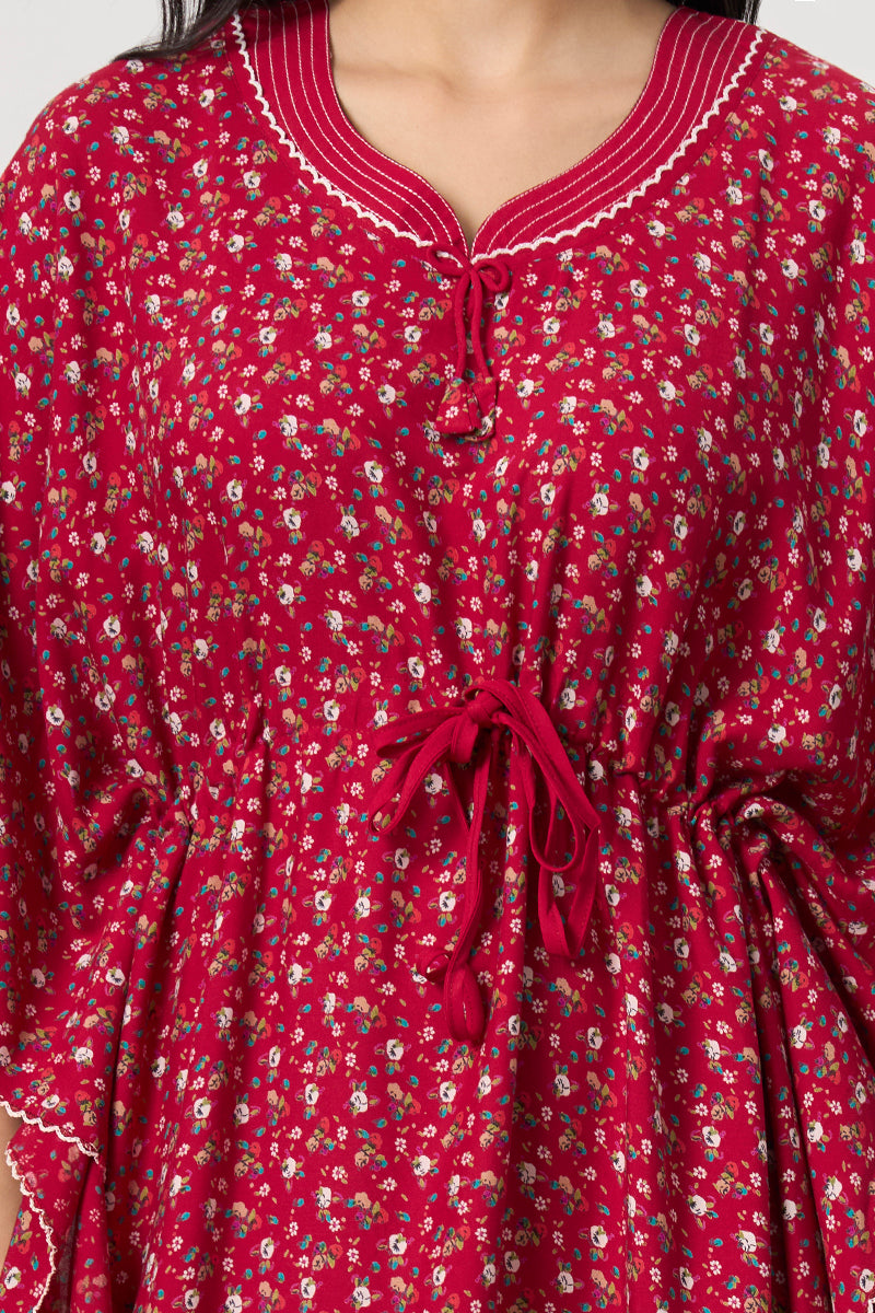 Close up of the tie neck and drawstring waist on the red floral kaftan