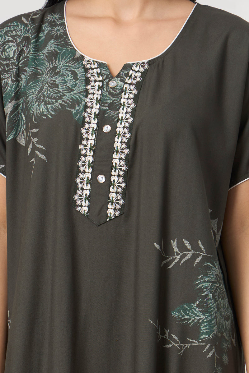 Close up of the lace trim neckline and button detail on the floral print nightgown