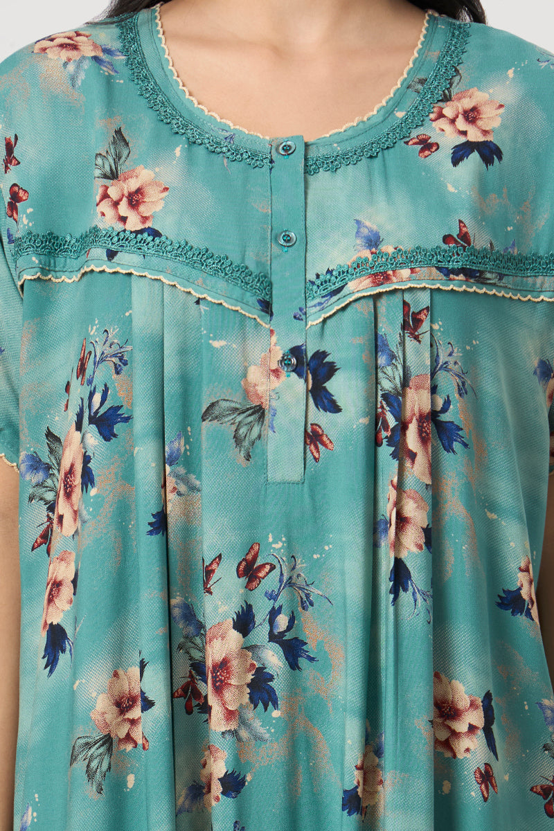 Close up of the lace trim and button placket on the teal nightgown neckline