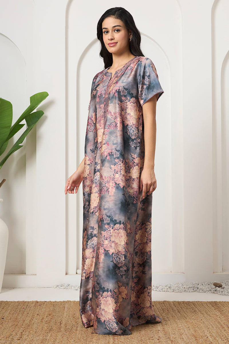 Woman standing sideways in a grey floral print nightgown