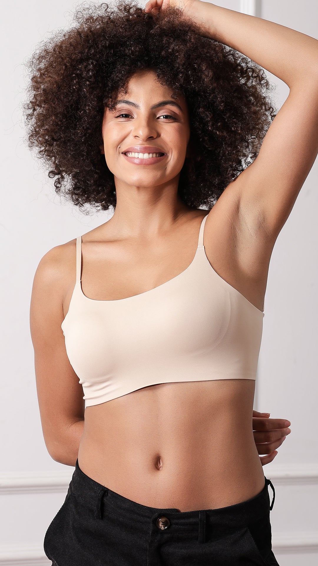 Seamless cami bralette with adjustable straps, front view on model